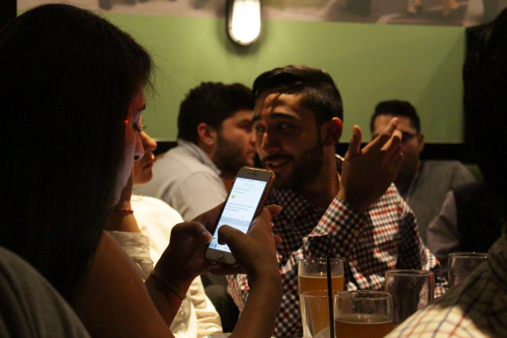 Students discuss the debate at a watch party in Washington DC.