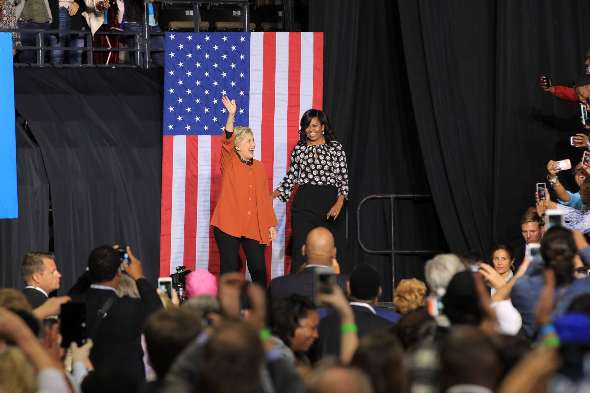 First lady Michelle Obama and Democratic presidential nominee Hillary Clinton take the stage to urge supporters to vote early and volunteer on Thursday in Winston-Salem, North Carolina.