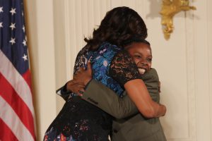 After waiting almost 45 minutes, Trae Weekes finally got her chance to hug First Lady Michelle Obama. Weekes is part of the True Colors: OUT Youth Theater in Boston. This is the first time a dedicated LGBTQ organization has been awarded from the committee (Kelly Norris/MNS).