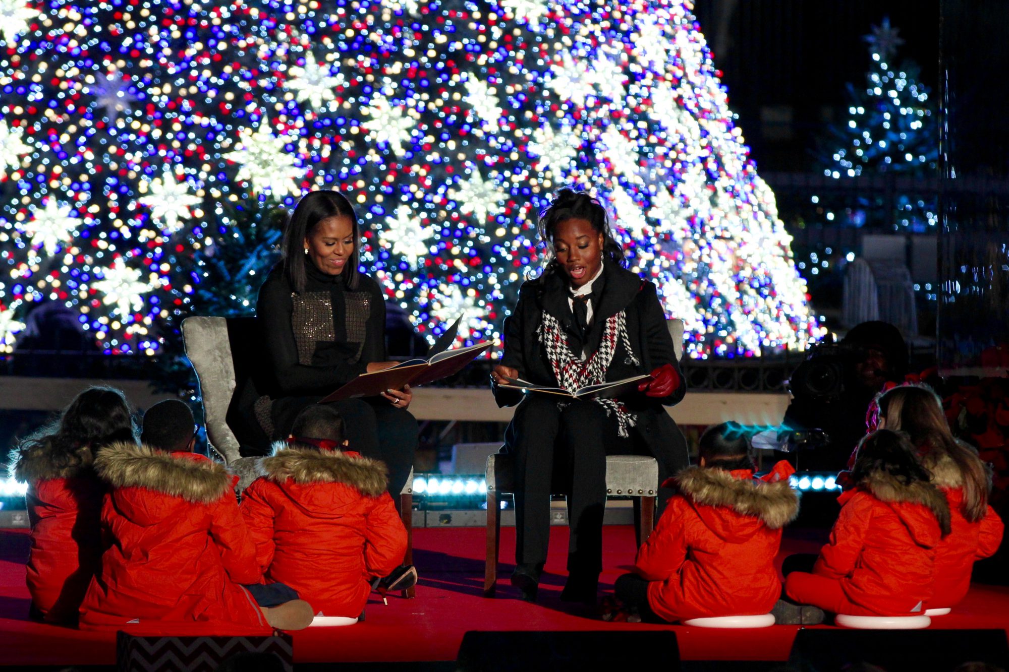 First lady Michelle Obama and Olympian Simone Manuel participate in the annual reading of "'Twas the Night Before Christmas." (Benjamin Din/MNS)
