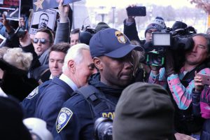 Stone enters the courthouse amid throngs of reporters, supporters and protestors. He remained uncharacteristically silent.