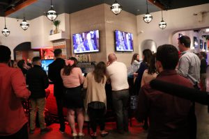 Members of Republican organizations gather around as President Trump continues past expected time in his State of the Union speech. (Brooke Fowler/MNS)