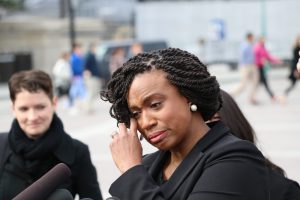 Rep. Ayanna Pressley, D-Mass., takes a moment to compose herself during her speech at Thursday’s press conference. (Cameron Peters/MNS)