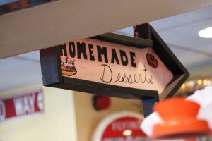A sign pointing in the direction of a buffet with cakes, pies and ice cream.  (Charlotte Walsh/MNS)