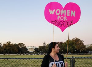 Attendees marched to the Ellipse, where some holding signs posed for photos in front of the White House.  (Caroline Killilea/MNS)