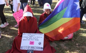 Some protesters dressed in costumes seen in the Handmaid’s Tale, a statement about American politicians who advocates feel aim to stifle the freedom of women. (Caroline Killilea/MNS)