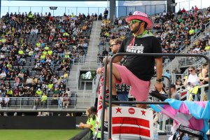 Spirit Squadron capo Kris Ramos helps lead fans in the "Free D.C." chant. (Desiree Luo/MNS)