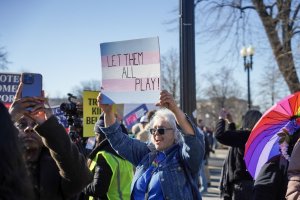 To the left of the barrier, pro trans athlete demonstrators held signs and joined in on group chants. (Cayla Labgold-Carroll/MNS)