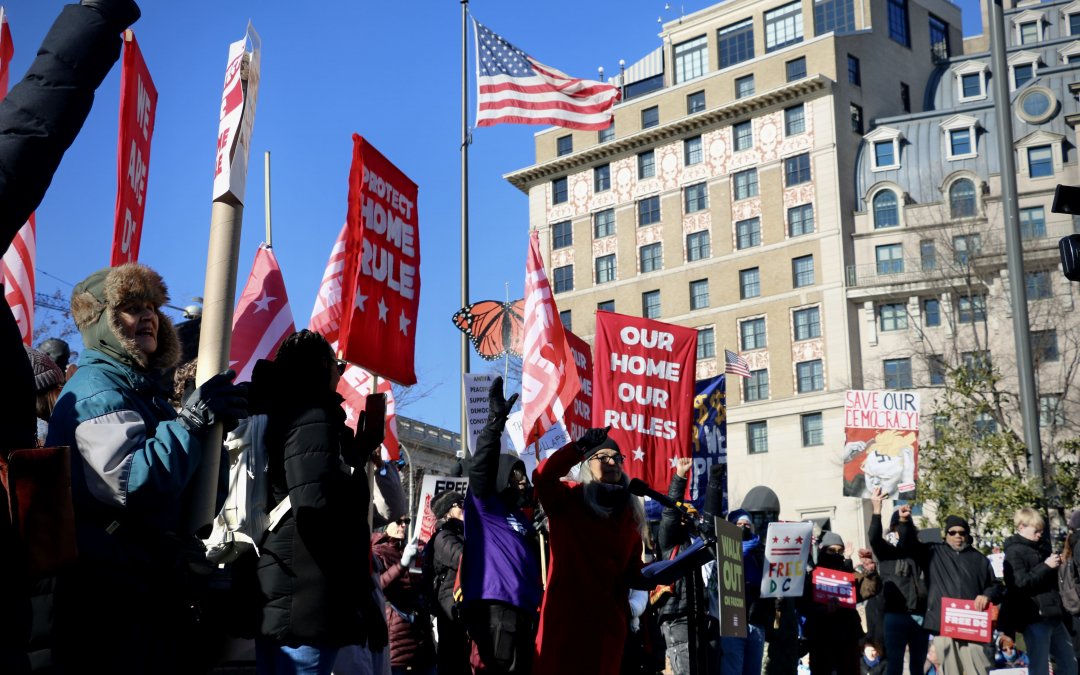 Free America Walkout draws hundreds on Trump’s inauguration anniversary