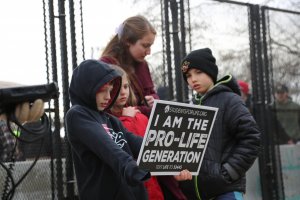 Children of all ages — from newborns to high schoolers, some with their parents and others without — marched on Friday. (Ben Shapiro/MNS)