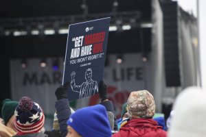 Signs with quotes from Charlie Kirk, the late right-wing activist who was shot and killed in September, were prominent at the rally. (Ben Shapiro/MNS)