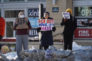 Many signs encouraged passersby to honk, leading to trucks and cars honking enthusiastically and repeatedly as they drove through the intersection. (Cayla Labgold-Carroll/MNS)