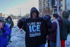 T-shirts that read “I like my ICE crushed” were distributed from a table on the sidewalk. (Cayla Labgold-Carroll/MNS)