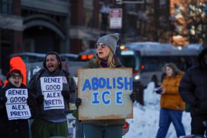 Many signs had the names of two citizens shot by ICE agents in recent weeks, denouncing their deaths. (Cayla Labgold-Carroll/MNS)