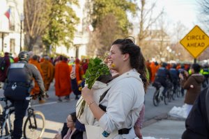 Many walkers handed out flowers to onlookers. (Cayla Labgold-Carroll/MNS)