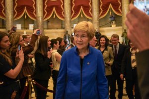 Rep. Elizabeth Warren, D-Mass., entered with the majority of senators, followed by their pages. (Cayla Labgold-Carroll/MNS)