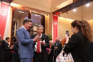 Oklahoma City Mayor David Holt shows Singaporean Ambassador to the United States Lui Tuck Yew his son’s Singapore LEGO set. (Dasha Dubinina/MNS)