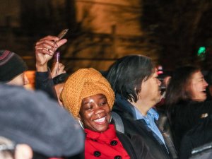 Onlookers took selfies with the lion dancers and hooted encouragement. (Melody Xu/Medill News Service)