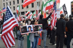 Many demonstrators brought signs honoring their loved ones who were killed during the January protests in Iran. (Brooke Sharp/MNS)