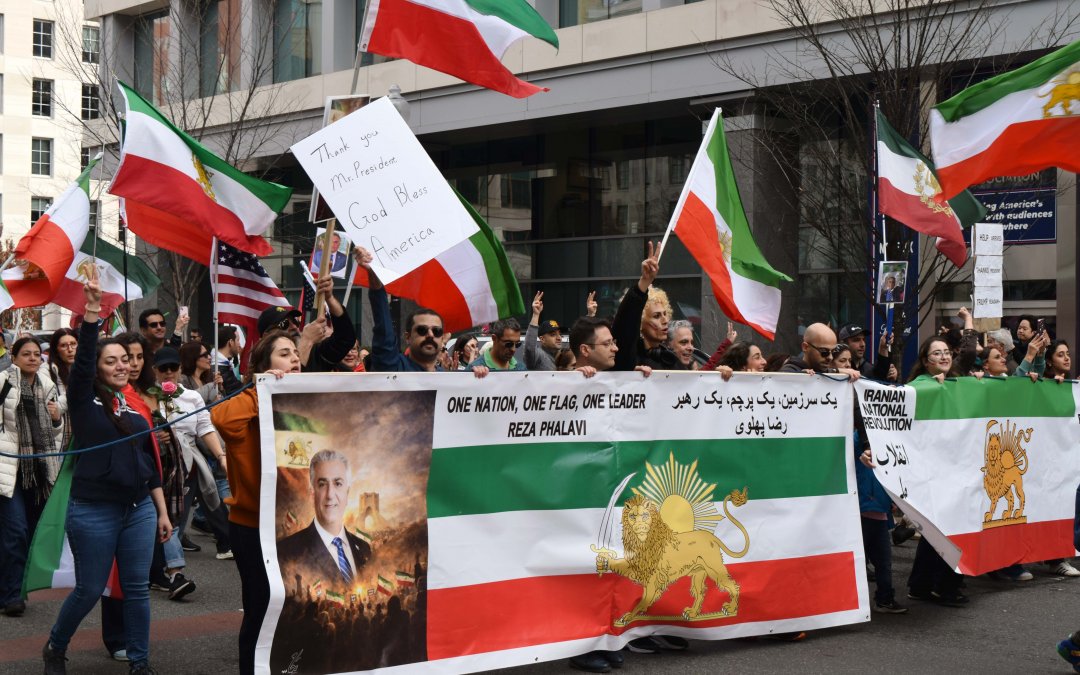 In Photos: From anti-war pleas to celebrations of a broken regime, two marches show a nation divided over Iran