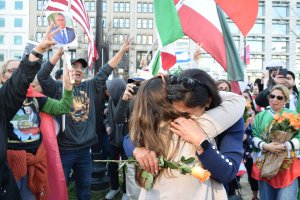 Two participants shared a hug after getting emotional, while the speakers of the rally addressed the crowd. (Brooke Sharp/MNS)