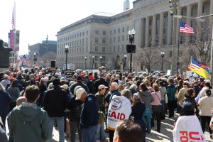 Families and friends of former USAID employees rallied together at the agency’s headquarters on Feb. 27, 2026. (Sarah Han/MNS)